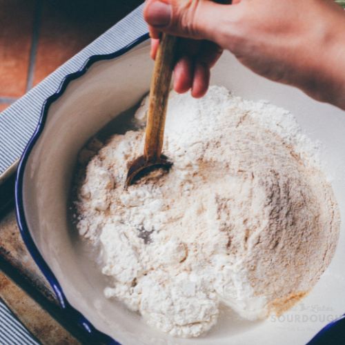 mixing sourdough bread