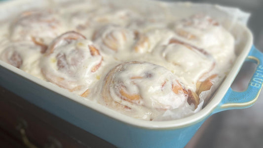 Cinnamon Cardamom Buns with Cream Cheese Icing in  STAUB ceramic dish