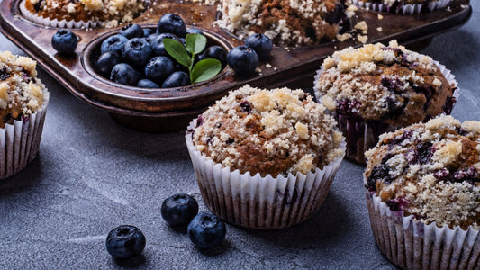 blueberry muffins with streusel topping in a vintage muffin tin