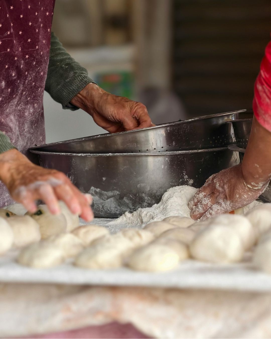 hands in dough and flour