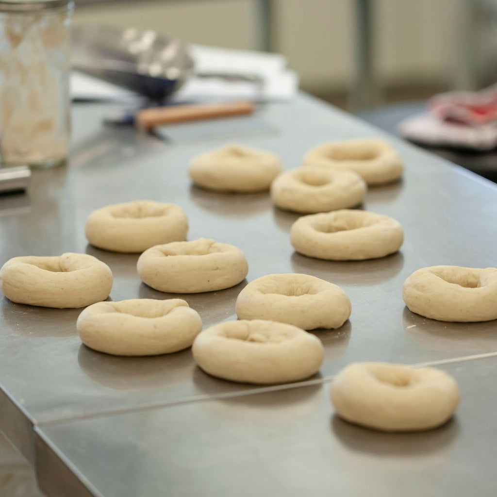 shaped bagels on a stainless steel counter