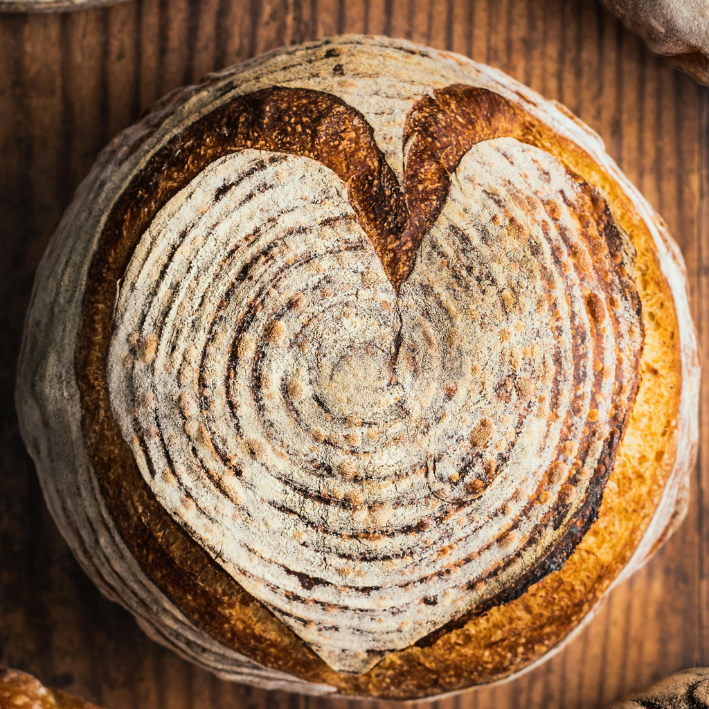 heart decorated sourdough loaf